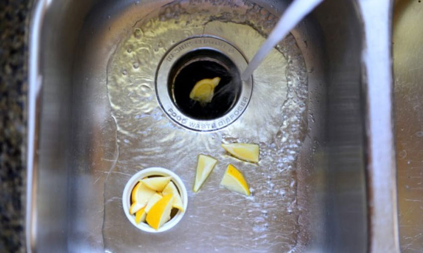 How to clean a garbage disposal with lemon