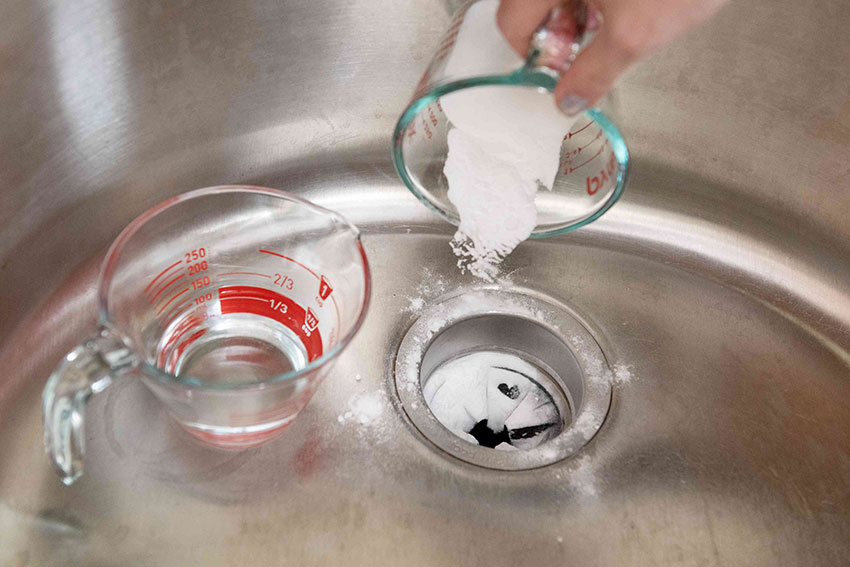How to clean a garbage disposal with baking soda and vinegar
