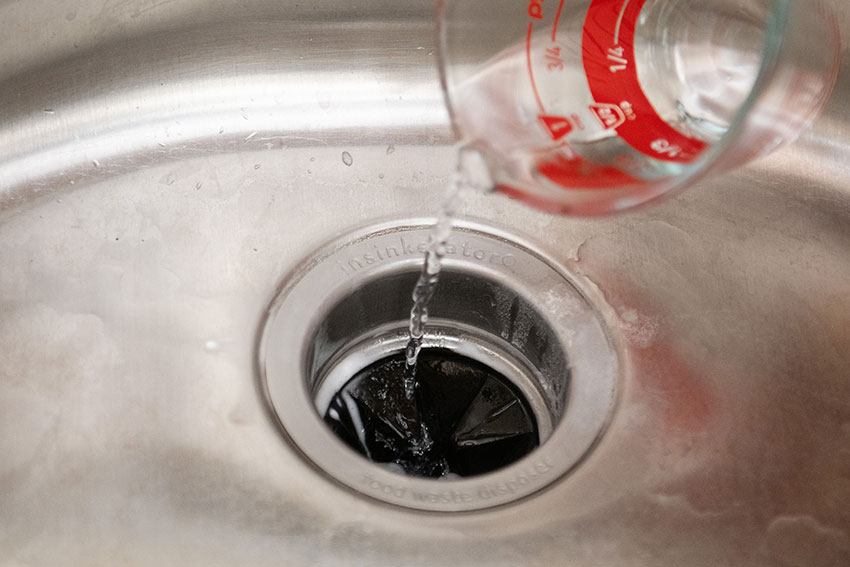 Can you clean a garbage disposal with bleach?