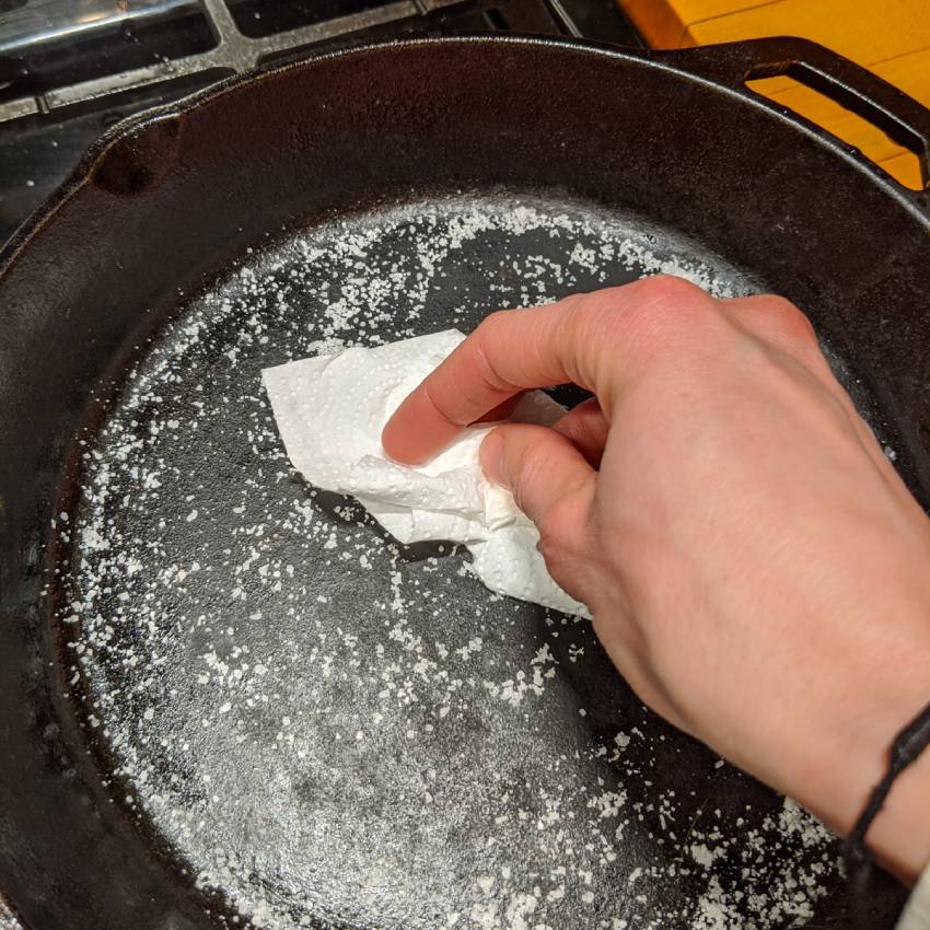How to clean black residue off cast iron skillet