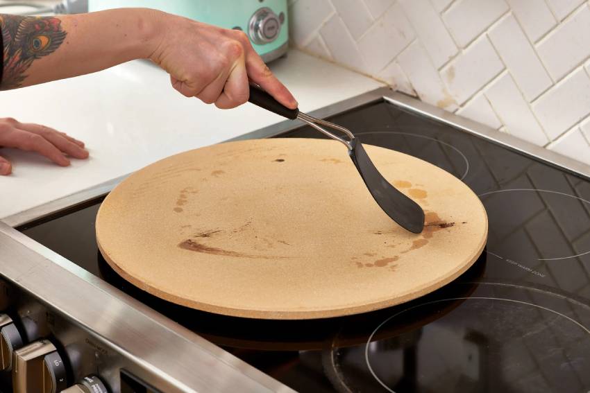 how to clean burnt pizza stone that is black