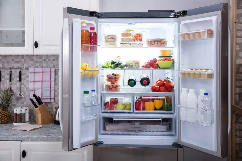 How do I organize my fridge to reduce food waste?