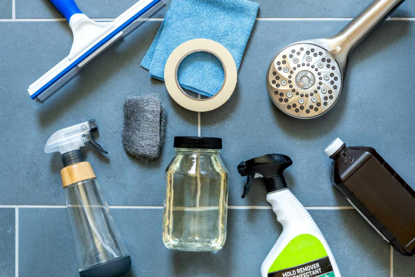 Tools and supplies to clean a marble shower
